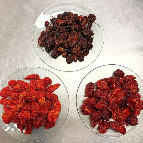 Three bowls of dried hot chillies