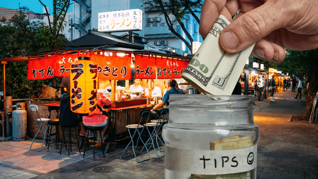 Picture of an open air ramen shop; in the foreground, a hand deposits USD into a jar