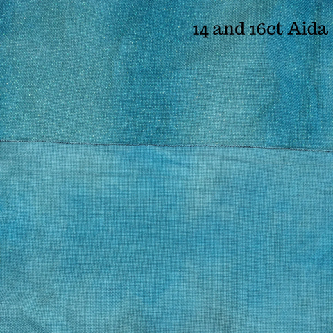 Aida fabric (one is sparkly) with a rich blue with darker blue waves