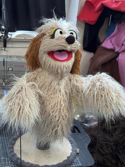 Beige dog hand puppet, right three quarter view