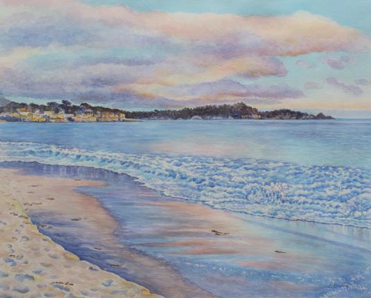 Watercolor painting of a beach at sunset. Waves of blue with reflections on the wet sand. Clouds with pink, orange, violet. Hills and buildings in the distance.
