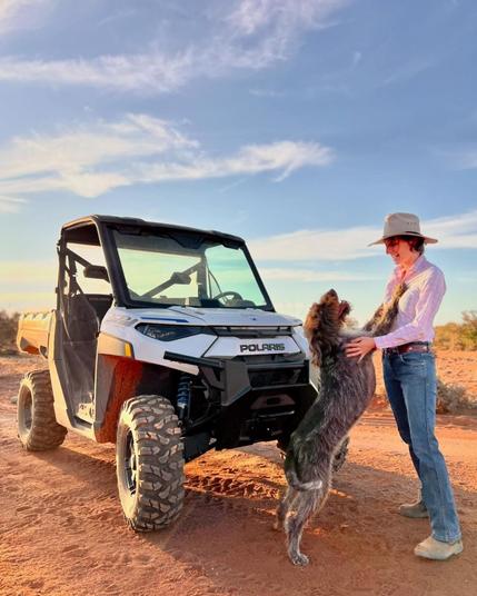 Anika, her dog Baxter and a solar powered ATV