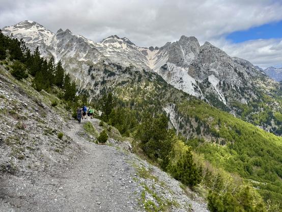 Shingle path leads towards snowy peaks