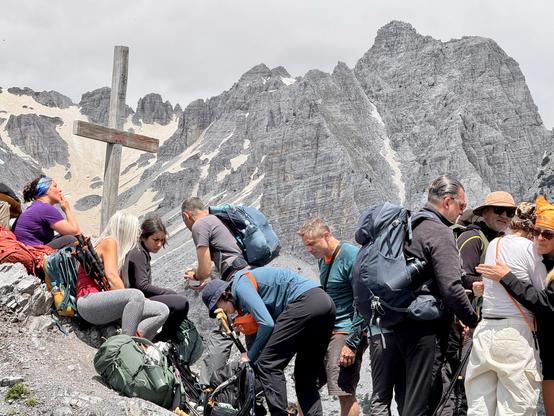 Cross at col, where walkers rest, converse & congratulate