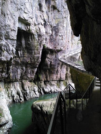 Suspended steel stairs into cave