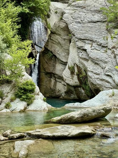 20m waterfall with rocky blue pool at its base