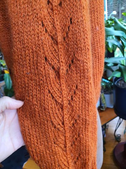 More detail of the sleeve of the orangey cardi