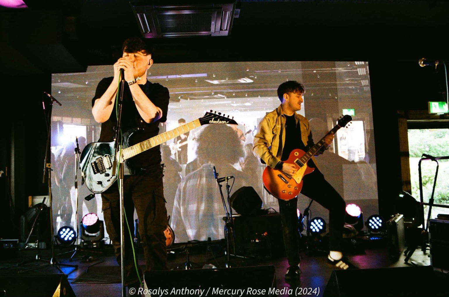 Local band on stage in colour film photograph