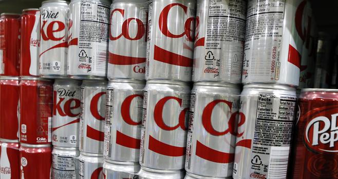 Small Diet Coke cans stacked together