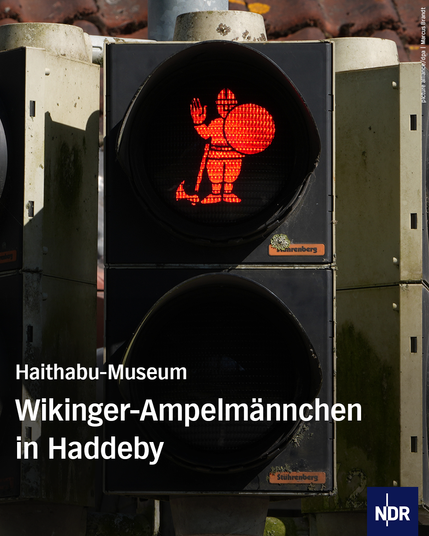 Bild: Eine Wikinger-Figur leuchtet auf einer Ampel rot.

Text: Haithabu-Museum

Wikinger-Ampelmännchen in Haddeby