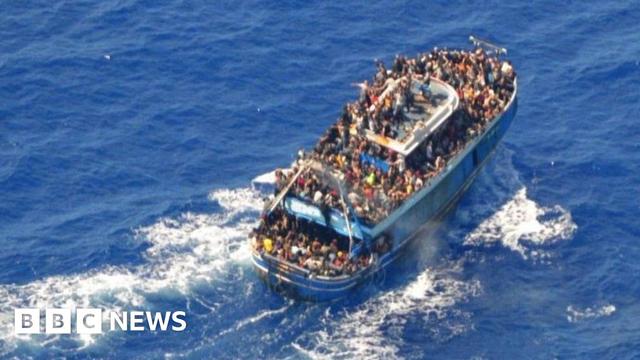 An undated photo provided by the Greek coastguard shows migrants on board the crowded fishing vessel, 14 June 2023