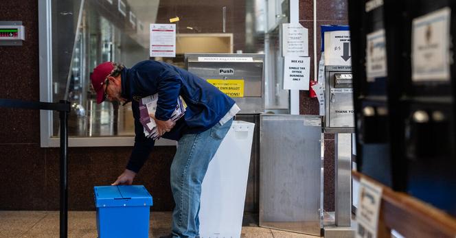 An official picking up mailed ballots in Scranton, Pa., on Election Day in 2024.