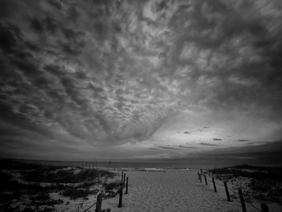 Winter beach side with low clouds spread in the sky