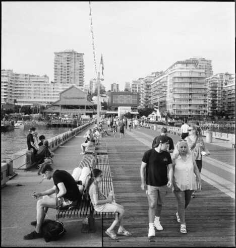 Assorted individuals cavort on the pier.