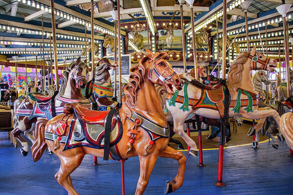 Colorful carousel horses stand proudly on the Seaside Heights carousel at the New Jersey Shore.  