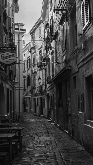 One of the back streets of Piran Slovenia, processed in black and white.
