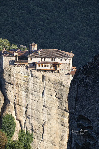 St Stephan's Monastery Meteora Kalabaka Greece Evening Light

The Monastery of St. Stephan's is situated at the top of a rocky precipice. Kukulas peak overlooks the monastery. In 1961, the monastery was converted into a convent.
The monastery of Agios Stefanos or St. Steven is by far the most accessible monastery, where instead of steps you simply cross a small bridge to reach the entrance. It is ideal for visitors with mobility issues who cannot use the steps and yet wish to have a real experience of a Meteora monastery.
The beginning of the Agios Stephanos monastery dates back to the early 12th century and the first hermit monks who settled on the cliff. Centuries later, Hosios Antonios, in the first half of the 15th century, and Hosios Philotheos, who renovated or rather rebuilt from its foundations the old small and elegant Catholicon, the present church of Agios Stephanos, in 1545 are mentioned as its founders.

https://fineartamerica.com/featured/st-stephans-monastery-meteora-kalabaka-greece-evening-light-wayne-moran.html

Learn more: https://waynemoranphotography.com/blog/monasteries-meteora-greece/

#Meteora #Greece #StStephans #monastery #monasteries #UNESCO #WorldHeritagesite #architecture #photography #Greekorthodox #Kalambaka #naturephotography  #travel #travelphotography #landscape #landscapes #landscapephotography #fineart #buyintoart #Ayearforart 
