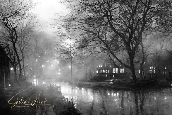 Late evening rain and fog in a residential section Philadelphia, Pennsylvania. As the fog was rolling in, the streetlamps and the lights from the houses gave off a beautiful glow and illuminated the rainy street with beautiful reflections. The original photograph has been digitally enhance to emulate a watercolor painting. Image by Shelia Hunt Photography.