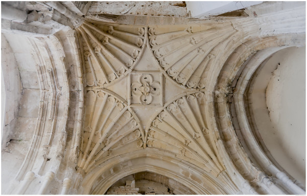 A colour photograph of part of the ceiling over the entrance area.

As I stepped inside I came under this four arch, vaulted ceiling.

As I understand things, after the dissolution these buildings were a target for state sponsored reclamation [looting and wilful damage anyone?]

Fortunately, restoration work is ongoing.