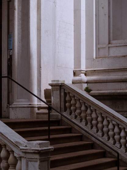 A section of a monumental stair up to the entrance of a building - probably a church.