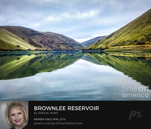 The beautiful Snake River is calm and placid with stunning reflections at Brownlee Reservoir in Oregon in the Pacific Northwest.  From the Fine Art Gallery of Shelia Hunt at Shelia-hunt.pixels.com