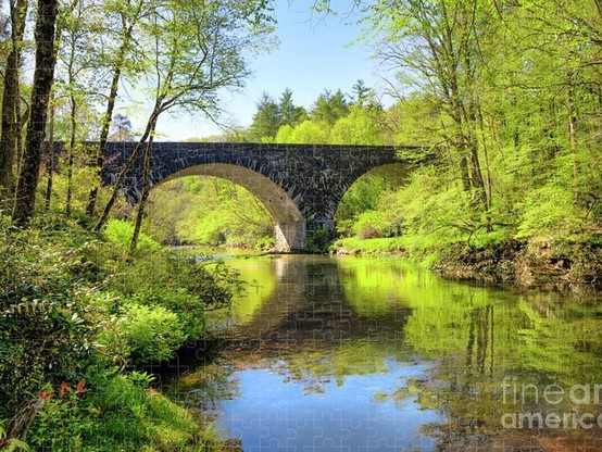 Jigsaw Puzzle, Blue Ridge Parkway, Linville River Bridge in Springtime, showing arches of the bridge with stunning reflection in the water! Very picturesque. From the Fine Art Gallery of Shelia Hunt.