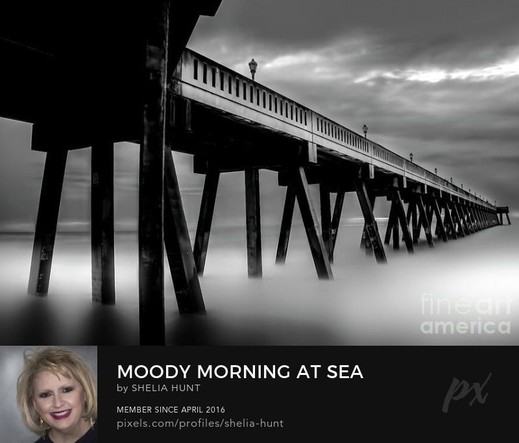 Johnnie Mercer Pier at Wrightville Beach, North Carolina is shown here with fog and mist rolling in and around the pier in early morning. This black-and-white image is from the Fine Art Gallery of Shelia Hunt.