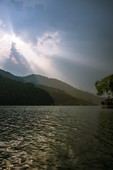 Rays of sunlight bursting though clouds over mountains surrounding Phewa Lake, Pokhara, Nepal
Captured by Komeil Karimi
