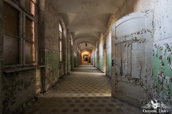 long corridor, peeling paint and tiled floor