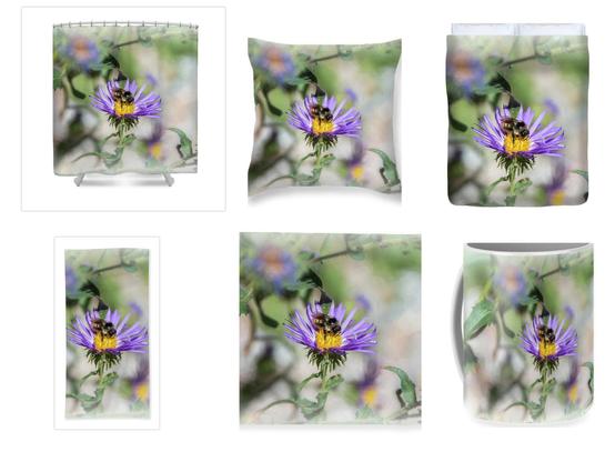 A single Honey Bee is on the yellow center of a purple Aster flower.  Surrounding the single in focus bloom is a softly blurred background of greenery.  Image is a collage of home decor in which the photograph is available to be printed on.  Shower Curtain,  Throw Pillow, Duvet Cover, Towels, Blanket and Coffee Mug.