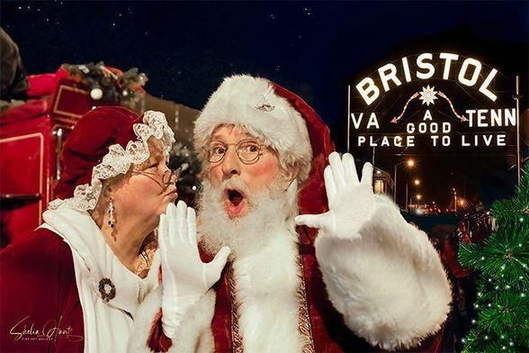 Santa and Mrs. Claus at a Holiday parade in Bristol Virginia-Tennessee at night near the iconic sign, “Bristol VA-Tenn, A Good Place To Live”.  From the Fine Art Gallery of Shelia Hunt.