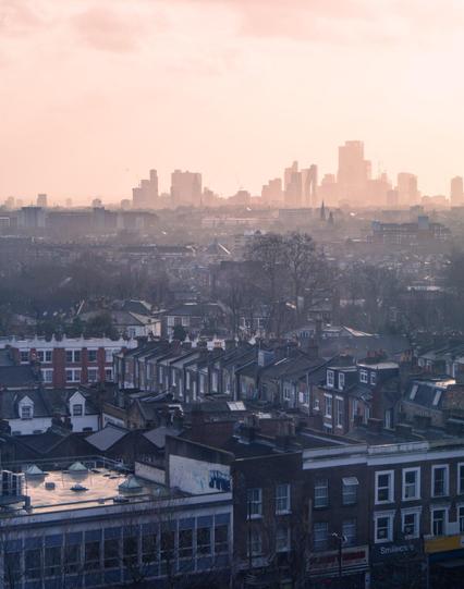 Preview of "Early Dawning" photo, showing a warm, hazy sunrise over London, UK.