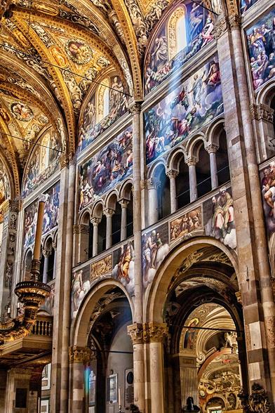 Interior of cathedral in Parma, Emilia-Romagna, Italy from XIIth century. In Parma, on the Piazza Duomo, stands the Cathedral of Santa Maria Assunta. Consecrated in 1106, it is a perfect example of Romanesque architecture.
The interior is rich in Gothic and Renaissance decoration.