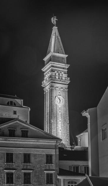 The clock tower of St George's Parish Church illuminated at night in Piran Slovenia. It is a faithful, albeit smaller, replica of St Mark's Campanile in Venice. 

https://joan-carroll.pixels.com/featured/st-georges-parish-church-clock-tower-piran-slovenia-joan-carroll.html

#piran #slovenia #blackandwhite #nightphotography #blackandwhitephotography #clocktower #stgeorge #sangiorgio #historic #cityscape #AYearForArt #buyIntoArt #giftideas #wallart #artforsale @joancarroll