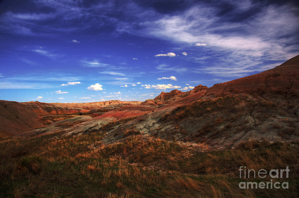 South Dakota Badlands Beautiful Afternoon

Four guys from the Twin Cities of Minneapolis and St Paul, went to the SD badlands for an early spring adventure.

The purpose of this trip was:
1. To get away from normal life and to get refreshed a little bit.
2. To hike.
3. To learn some new photography techniques.
4. And to capture a certain picture that I had in my minds eye.

That certain picture was to be the majestic badlands (The grand canyon of the Midwest) in morning or evening light, you know, sunrise or sunset time frame.

Well it was only the first evening that we were there. The light conditions were not what I was looking for. So while I did not get the perfect shot, I did have a great adventure.

The South Dakota Badlands are a rugged, otherworldly landscape of eroded rock formations, deep canyons, and sprawling prairies. Located in Badlands National Park, this region is famous for its striking layered rock formations, which display vibrant hues of red, orange, yellow, and white due to sediment deposits over millions of years. The dramatic scenery was shaped by wind and water erosion, creating jagged peaks, towering spires, and deep ravines.

Image:
https://fineartamerica.com/featured/south-dakota-badlands-beautiful-afternoon-wayne-moran.html

Read more:
https://waynemoranphotography.com/photography/south-dakota-badlands-photography/

#SouthDakota #Badlands #NationalPark #nature #hike #landscape #photography #travel #travelphotography

#AYearForArt #buyintoArt 