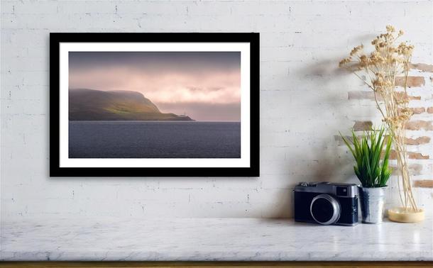 Preview of "Lighthouse, Light Patches" photo print hung on a white brick wall withing a black frame.