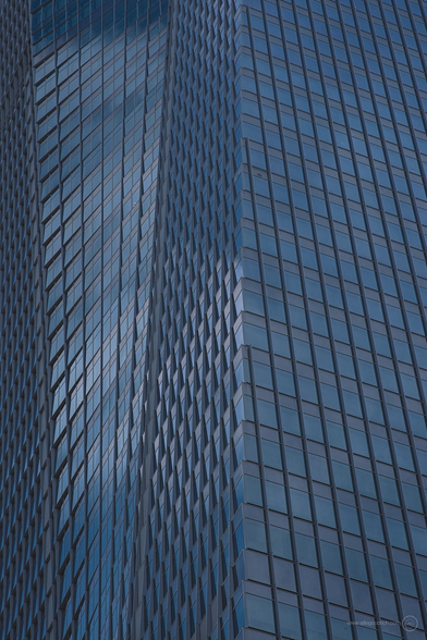 Later afternoon light on one of the main high rises in the Toranomon development in Tokyo. This building is about 45 or 50 floors high. The paterns of the windows are mesmeric. 