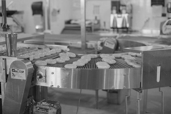 Krispy Kreme donuts hot and fresh on the assembly line!
