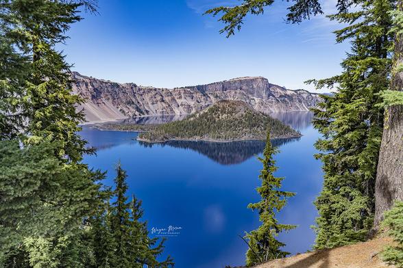 Crater Lake Oregon A Deep Blue Wonder of Nature

Right in the heart of southern Oregon's Cascade Mountains, Crater Lake is a breathtaking natural marvel, known for its intense sapphire-blue waters, remarkable clarity, and dramatic geological history. Formed over 7,000 years ago by the collapse of the ancient Mount Mazama volcano, this deep caldera lake is the deepest lake in the United States, plunging to a depth of 1,943 feet (592 meters).

Surrounded by towering cliffs that rise up to 2,000 feet above the lake's surface, Crater Lake lies within Crater Lake National Park, a protected wilderness rich with forests, volcanic rock formations, and diverse wildlife. The lake itself has no rivers flowing in or out; instead, it is fed entirely by rain and snow, which contributes to its stunning purity and color.

Wizard Island, a cinder cone that emerged after the initial eruption, rises from the western side of the lake, resembling a miniature volcanic island. Nearby, the eerie Phantom Ship, a jagged rock formation, juts up from the water like a ghostly schooner, adding to the lake’s mystical appeal.

https://fineartamerica.com/featured/crater-lake-oregon-a-deep-blue-wonder-of-nature-wayne-moran.html

#CraterLake #NationalPark #Oregon #Nature #hiking #Landscape #photography #travel #travelphotography

#AYearForArt #buyintoArt