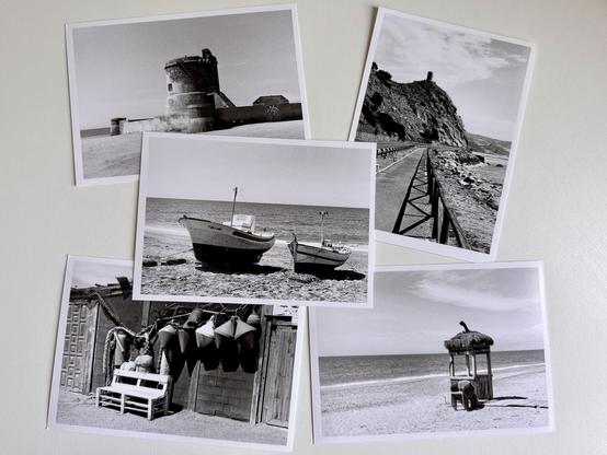 Darkroom prints laid out on a worktop