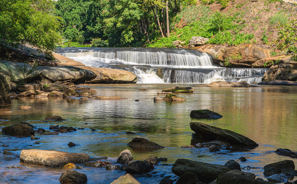 Long Exposure Waterfalls at Falls Park on the Reedy in Greenville South Carolina

Falls Park on the Reedy, located in the heart of downtown Greenville, South Carolina, is a stunning urban oasis centered around the breathtaking waterfalls of the Reedy River. These cascading falls serve as the park’s focal point, offering a picturesque blend of natural beauty and city charm. The multi-tiered waterfalls flow gracefully over rocky ledges, creating a mesmerizing sight that draws photographers, nature lovers, and visitors year-round.

The park’s signature Liberty Bridge, a curved pedestrian suspension bridge, provides an unparalleled view of the falls from above, enhancing the dramatic scenery. Lush gardens, walking trails, and artistic installations surround the waterfalls, making Falls Park a perfect destination for relaxation, exploration, and inspiration. Whether enjoying a peaceful stroll, capturing the falls at golden hour, or simply taking in the serene sound of rushing water, Falls Park on the Reedy offers an unforgettable experience in one of Greenville’s most beloved landmarks.

Image:
https://fineartamerica.com/featured/long-exposure-waterfalls-at-falls-park-on-the-reedy-in-greenville-south-carolina-wayne-moran.html

Read more: 
https://waynemoranphotography.com/blog/exploring_greenville_south_carolina/

#Greenville #SouthCarolina #waterfalls #FallsPark #Reedy #Landscape #photography #travel #travelphotography

#AYearForArt #buyintoArt
