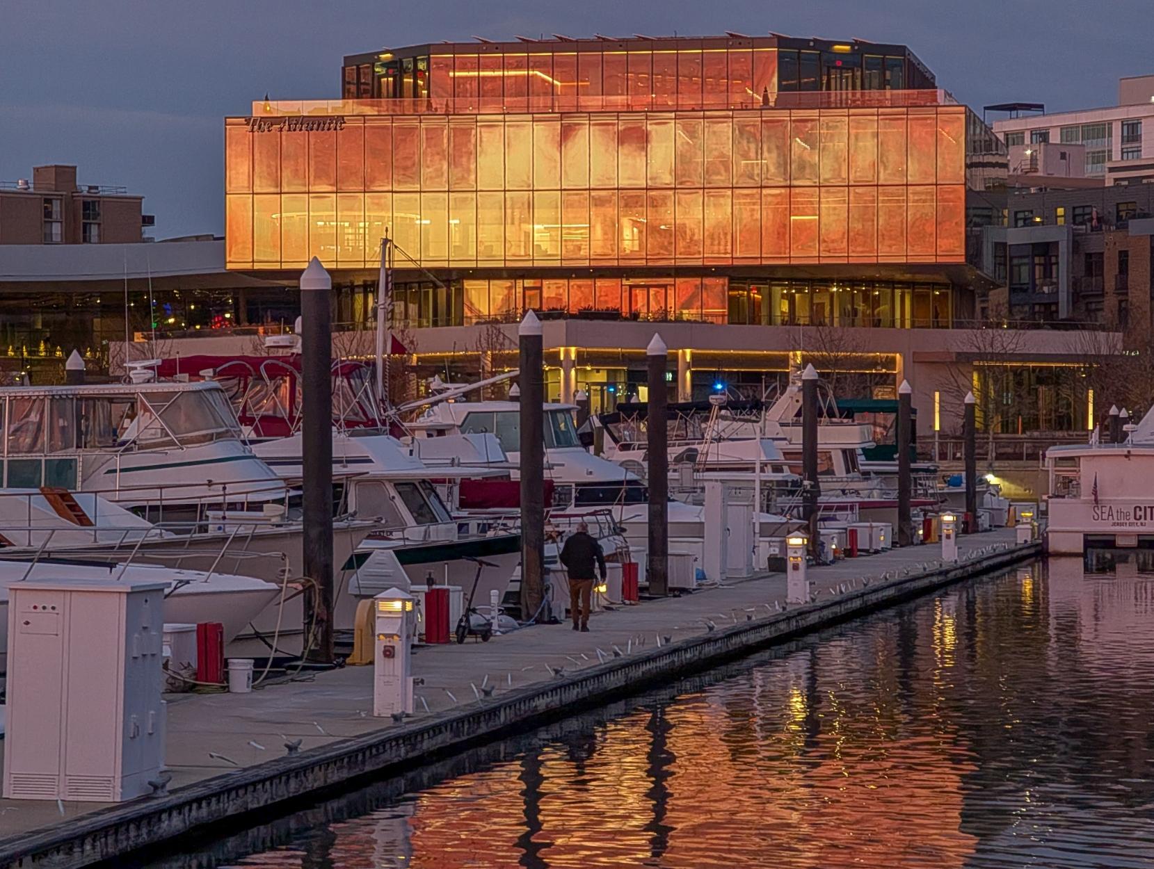 Golden light at sunset reflecting in the Atlantic building on the Washington Channel