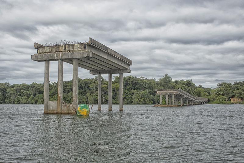 New concrete bridge at a river in Suriname is broken down
