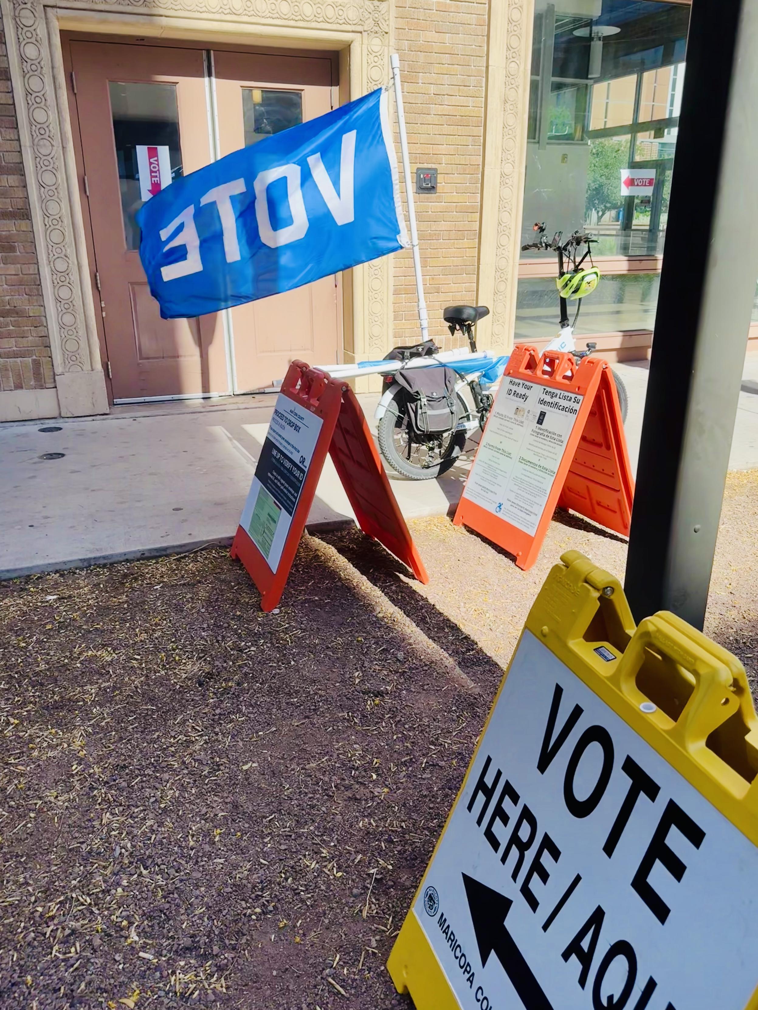 My bike flying the VOTE flag in front of a polling station in Phoenix