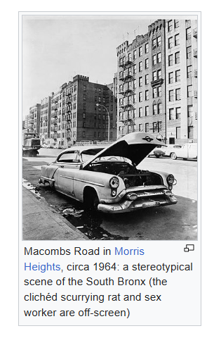 photo of a busted car captioned: "Macombs Road in Morris Heights, circa 1964: a stereotypical scene of the South Bronx (the clichéd scurrying rat and sex worker are off-screen)" photo of a busted car captioned: "Macombs Road in Morris Heights, circa 1964: a stereotypical scene of the South Bronx (the clichéd scurrying rat and sex worker are off-screen)"
