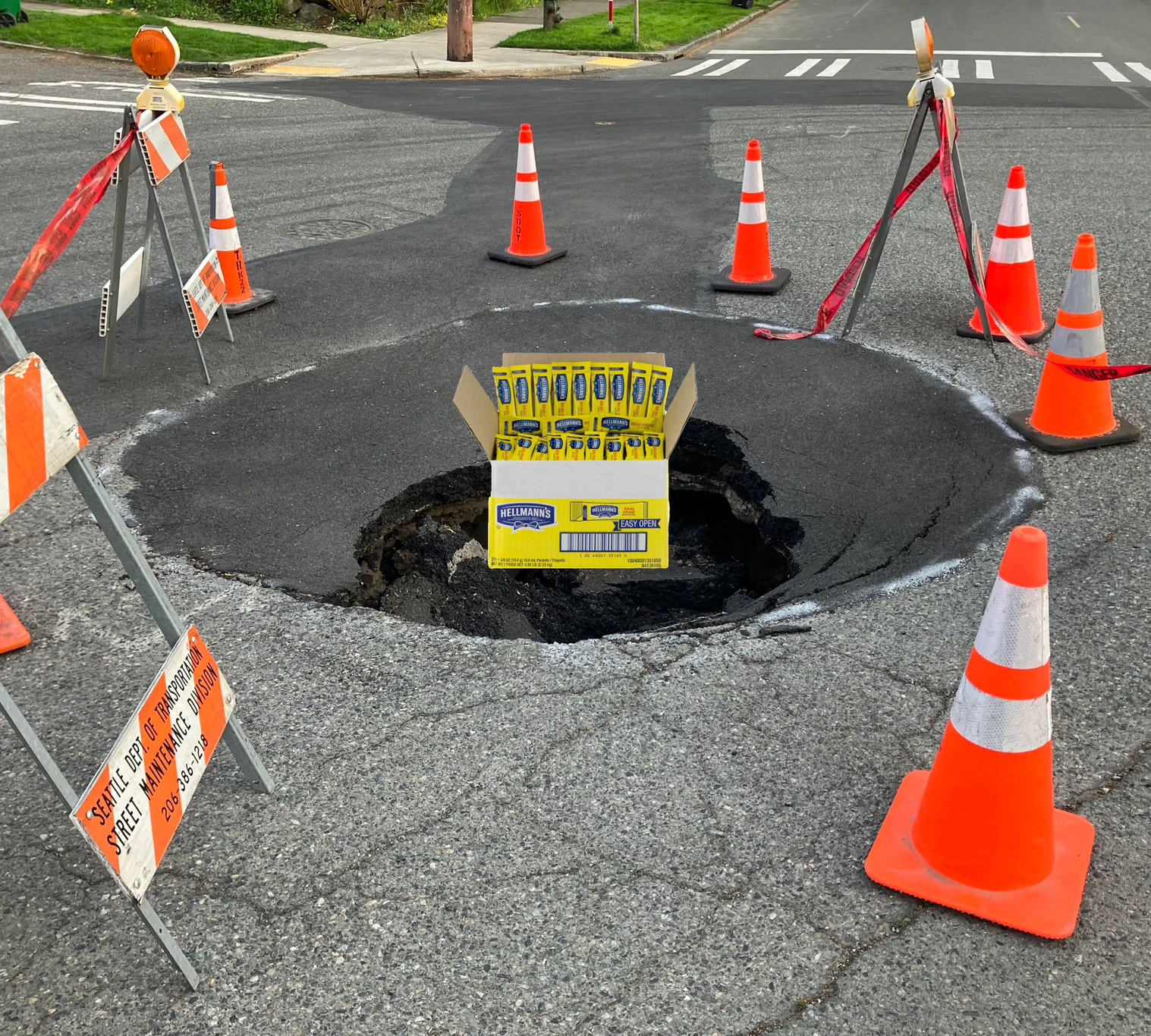 Sinkhole with box filled with mayonnaise packets.