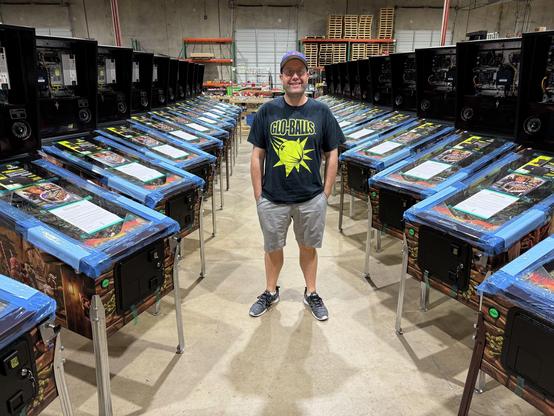 Barrels of Fun co-found David van Es standing between rows of its fiirst game, Labyrinth.