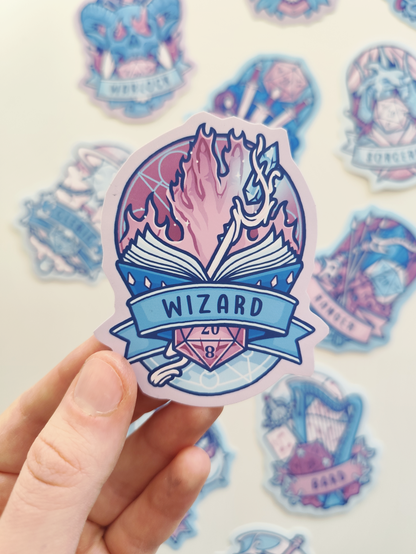 hand holding up a sticker of the wizard, showing a hand in flames above a magical book