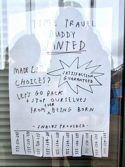A paper sign which reads Time Travel Buddy Wanted. Made bad choices? Let's go back and stop ourselves from ever being born. Satisfaction guaranteed. Snacks provided.