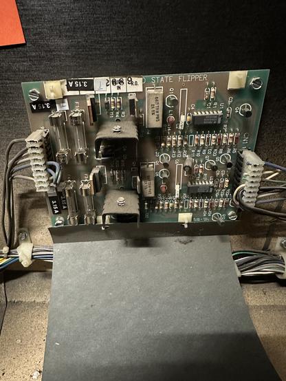 A PCB labeled SOLID STATE FLIPPER
